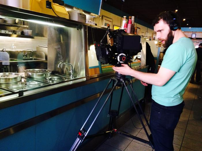 Filmaker Adam Coleman shoots footage of the Liebmann's Deli Counter