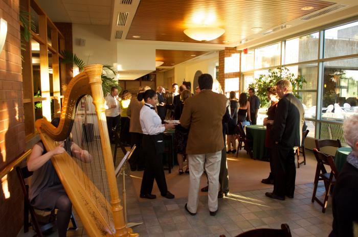 Harpist Mia Theodoratus entertains the early guests during the Cocktail Hour in the Solarium